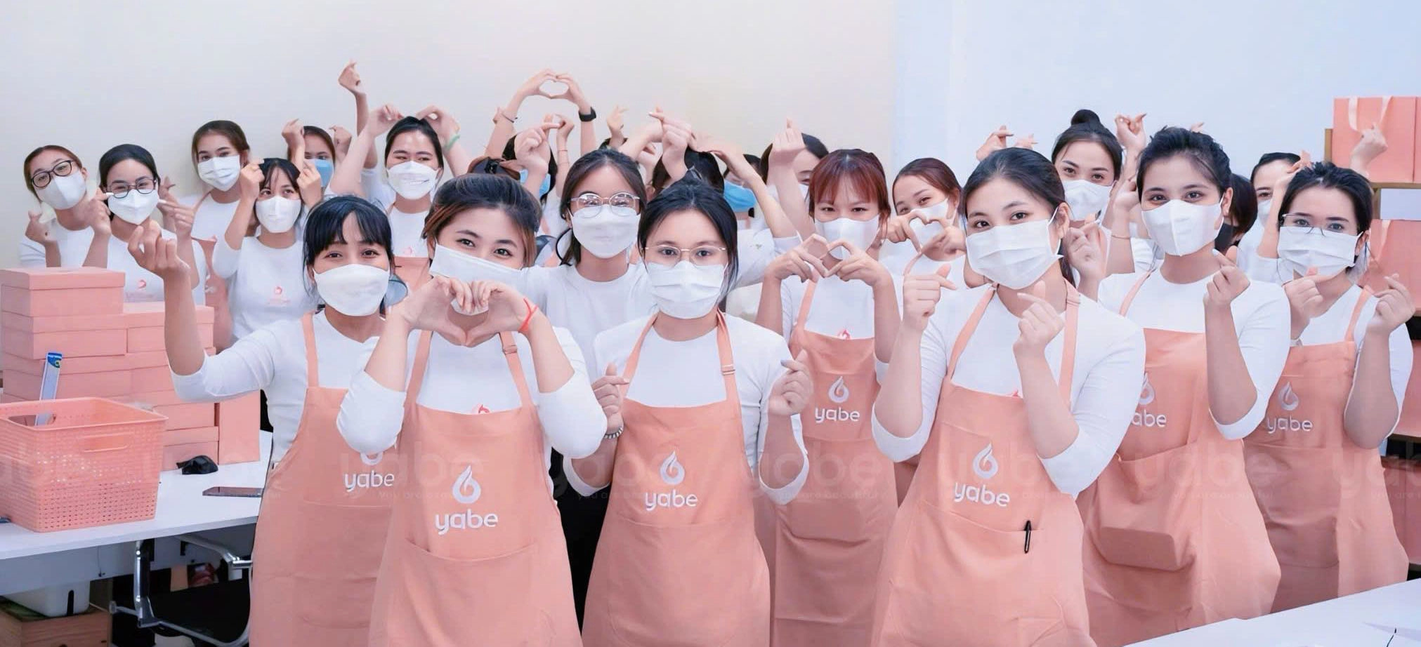 Yabe team making heart shapes with hands